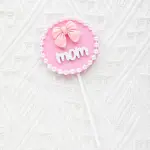 Mom with bow with pearl boarder cake topper