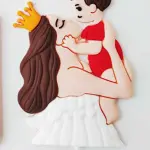 Mom holding child cake topper