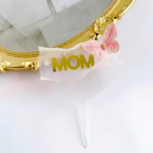 Mom with round transparent with butterfly cake topper